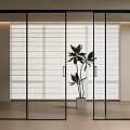 Modern Black Frame Glass Sliding Doors In Bright Interior With Indoor Plant And Wooden Floor