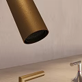 Stylish Faucets with Different Finishes on Light Gray Countertop and Beige Wall