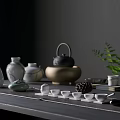 Stylish Tea Set With Teapot Teacups And Green Plant On Dark Wooden Table