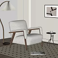 Plush Beige Leisure Chair With Wooden Arms Floor Lamp And Abstract Art In Living Room