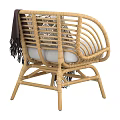 Natural Style Wicker Single Sofa With White Cushion Dark Blanket And Decorative Pillow