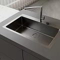 Modern Stainless Steel Kitchen Sink With Faucet On Gray Countertop And Cabinets