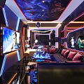 Modern KTV Room Interior With Neon Lights Large Screen TV And Starry Ceiling