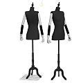 Two Black Mannequins Wearing Sequined Dresses With White Arms On Stands