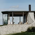 Rustic Guesthouse Architecture With Stone Wall Glass Facade Chimney And Trees In Green Grass Surroundings
