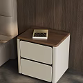 Modern Bedside Table With Light Gray Drawers Brown Wooden Top And Book On Surface