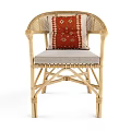 Stylish Natural Rattan Armchair With Red Geometric Cushion And Woven Accents