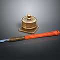 Brass Inkwell And Wooden Handle Letter Opener On Dark Surface