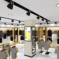 Stylish Clothing Store Interior With Displayed Apparel Clothing Racks And Checkout Counter