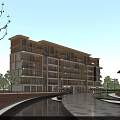 Modern Multi story Residential Building With Large Glass Windows Surrounded By Greenery Water Pathway And Trees