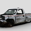 White Damaged Pickup Truck With Crushed Front End And Dented Body