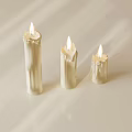 Three Lit White Decorative Candles With Soft Light And Shadow Effects