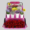 Colorful Floral Display On Multi Tiered Pink Cart With Sunflowers Roses And White Pots