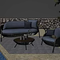 Gray Wicker Outdoor Sofa with Cushions in Poolside Garden and Armchair Coffee Table