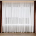 Sheer White Curtains With Brown And Beige Heavy Panels In Modern Interior Window Design