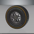 Car Tire And Alloy Wheel Rim With Silver Spoke Design And Orange Accent