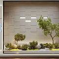 Indoor Garden Miniature Display With Green Plants Stones And Textured Wall
