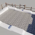 Square Outdoor Area With Pebble Ground And Wooden Fence Surrounding Structure