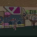 Kindergarten Indoor Play Area With Kids Playing On Climbing Net And Slide