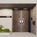 Textured Metal Front Entrance Door With Circular Design Green Plants And House Number