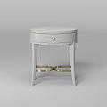 Round Light Gray Bedside Table With Single Drawer And Golden Metal Legs Design