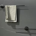 Modern Bathroom Towel Bars With Black Finish On Marble Wall And White Towel