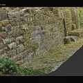 Ancient Stone Wall Covered With Moss Along Stone Path And Green Plants 3d model