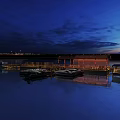 Scenic Night View of Offshore Platform with Blue Sea and Illuminated Lights