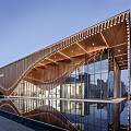 Modern Sales Office Building With Curved Metal Facade Glass Curtain Wall And Water Reflection