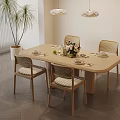 Modern Minimalist Dining Space With Wooden Table Rattan Chairs Pendant Lights And Green Plant