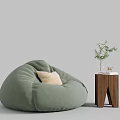 Light Green Bean Bag Chair with Wooden Side Table Green Plant and Books