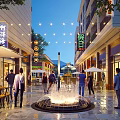Vibrant Commercial Street With Pedestrians Shopping Central Fountain Outdoor Tables Umbrellas Illuminated Storefronts String Lights