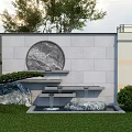 Gray Stone Brick Courtyard Background Wall With Round Marble Decoration Water Feature And Green Plants