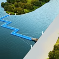 Scenic Blue Zigzag Bridge Over Water Surrounded by Trees and Green Grass