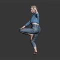 Woman In Blue Shirt And Patterned Pants Dancing On One Leg Holding Object Gray Background