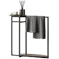 Daily Washing Essentials On Black Metal Stand With Soap Bottle And Gray Towel