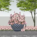 Blue And White Teacup Planter With Pink Roses Surrounded By Trees And Small Flowers