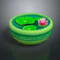 Pink Lotus Flower And Green Lily Pads In Green Patterned Bowl On Water Surface