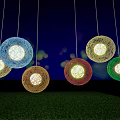 Colorful Spherical Pendant Lights with Woven Design Illuminating Green Grass Area