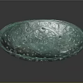 Green Oval Architectural Decorative Element With Intricate Carvings And Glossy Surface