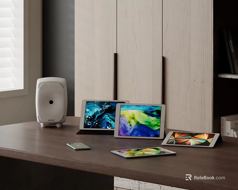 Modern Tablets And Smartphones On Wooden Table With White Speaker And Cabinets 3d model 