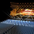 Modern Stage Design Featuring Golden Lighting Steps Blue Seats And Background Screen
