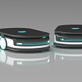 Two Smart Machines With Black Design Blue Lights And Moving Wheels