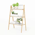 Three Tiered Wooden Ladder Shelf For Indoor Garden Decor With Green Plants And Books