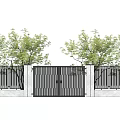 Garden Courtyard With Iron Gate Fence And Light Colored Walls Surrounded By Green Trees