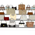 Various Stylish Handbags In Different Colors Neatly Arranged On White Shelves