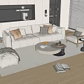 Modern Beige Sofa and Round Coffee Table Set with Pillows Armchair Rug and Natural Light