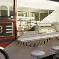 Vintage Food Truck Restaurant With Outdoor Seating Tables Chairs And Umbrella