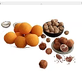 Fresh Oranges Walnuts And Chocolate Truffles On White Display Platters