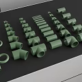 Different Green Pipe Fittings Including Elbows And Straight Tubes Arranged On Black Surface